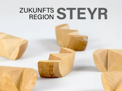 Holzbausteine symbolisieren das Netzwerk Zukunftsregion Steyr